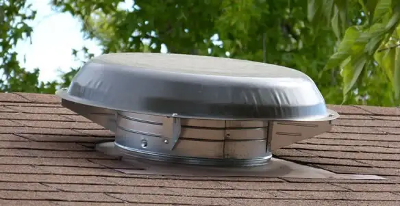 attic fan installation services with low-profile roof ventilation unit in Des Moines, IA