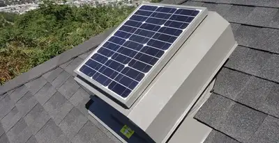 attic fan installation services with energy-efficient roof-mounted ventilation system in Des Moines, IA