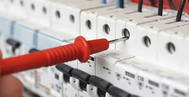 Electrical contractor testing circuit breakers during electrical repair in Norwalk, IA