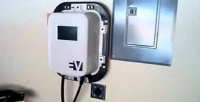 Electric car charger installation with wall-mounted EV charging station in Des Moines, IA