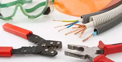 Electrical wiring repair with professional tools and safety equipment in West Des Moines, IA