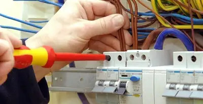 electrician services performing professional electrical panel wiring and connections in Des Moines, IA