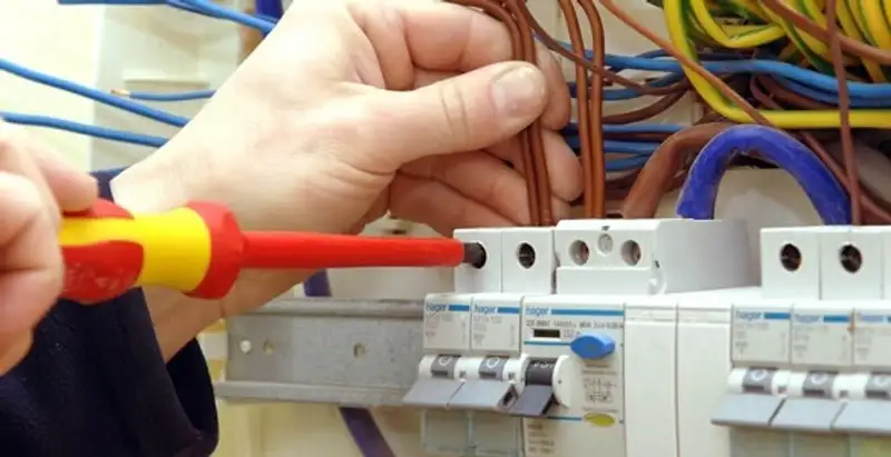 electrician services performing professional electrical panel wiring and connections in Des Moines, IA
