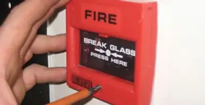 fire alarm installation service showing manual fire alarm pull station installed by licensed electricians in Des Moines, IA