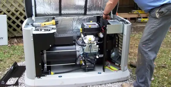 generator installation service showing technician connecting and configuring generator components in Des Moines, IA
