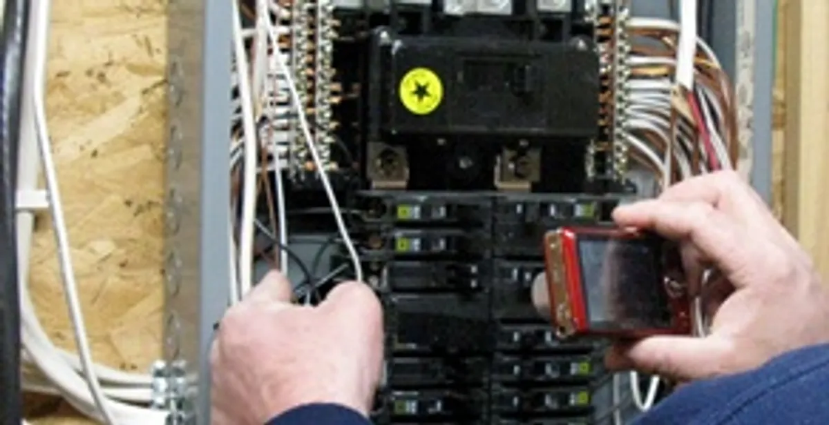 Home electrical inspection of circuit breaker panel by licensed electrician in Des Moines, IA