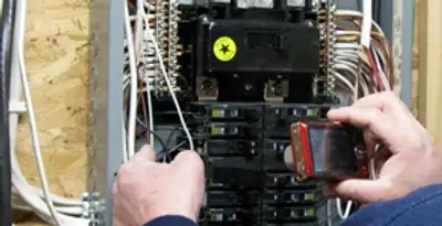Home electrical inspection of circuit breaker panel by licensed electrician in Des Moines, IA