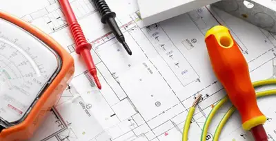 licensed electrician planning and testing electrical systems using professional tools in Des Moines, IA