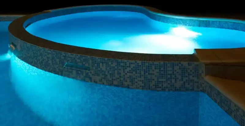 pool light installation and repair services highlighting illuminated pool interior lighting in Des Moines, IA