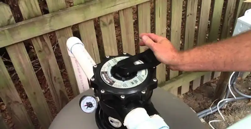 pool pumps service showing professional adjustment of pool pump control system in Des Moines, IA