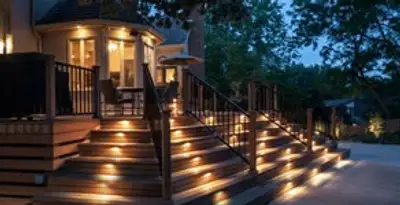 Residential electrician installing outdoor lighting for home safety in Des Moines, IA