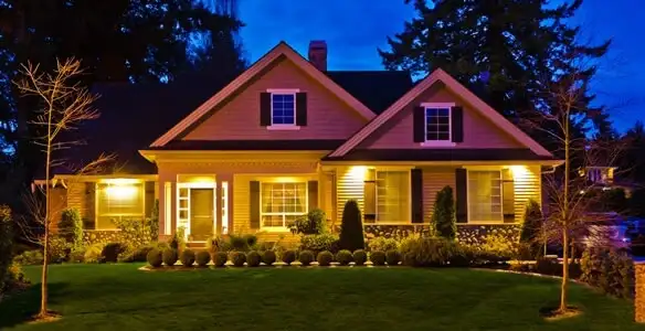 security light installation services illuminating a residential exterior at night in Des Moines, IA