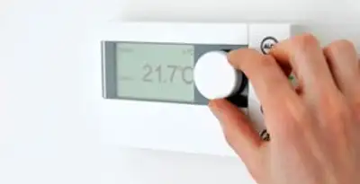 Thermostat installation service with professional adjusting temperature control in Des Moines, IA