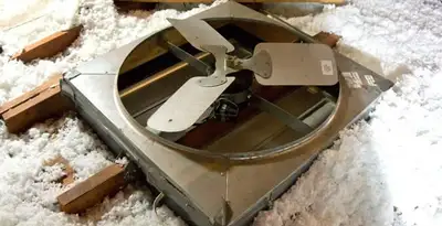 whole house fan installation services with attic-mounted ventilation unit in Des Moines, IA