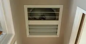 whole house fan installation services with ceiling-mounted ventilation system in Des Moines, IA